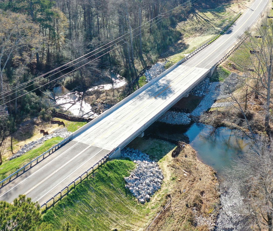 Aerial view of the completed bridge open to traffic. The dam and spillways for Lake Spivey, which limited the options for construction, are to the right of the photograph. Photo: C.W. Matthews Contracting Co. Inc.