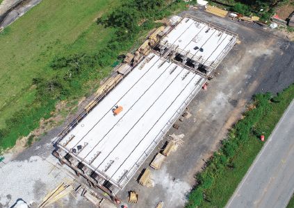 Aerial view of the on-site staging area showing completed decked beam units for spans 2 and 3. Photo: C.W. Matthews Contracting Co. Inc.